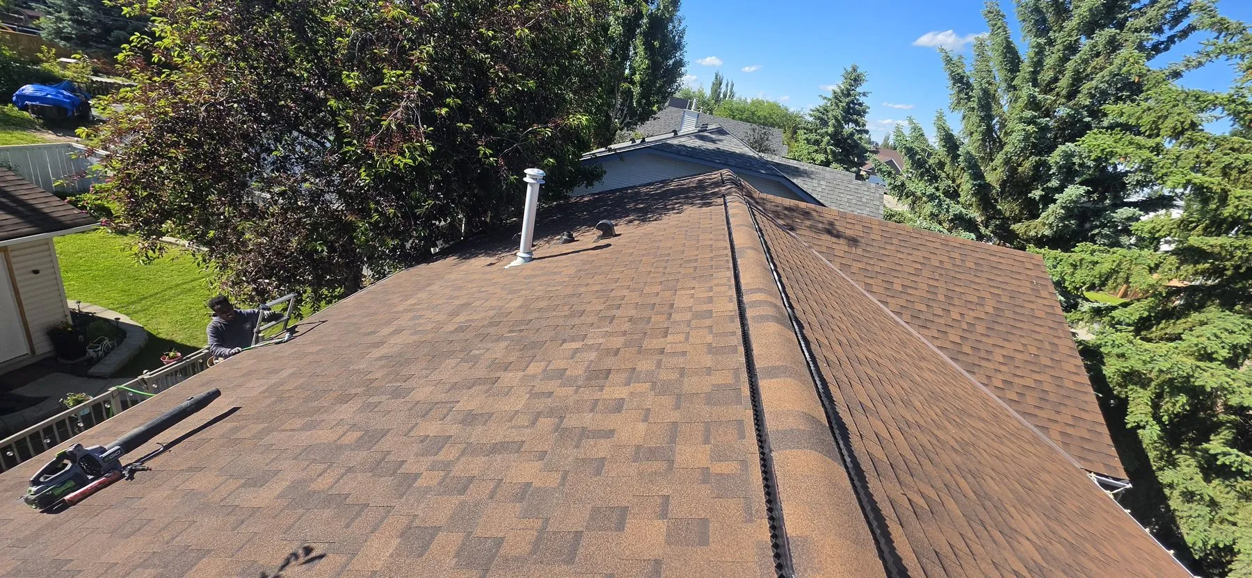 Completed asphalt shingle roof after a partial replacement in Strathmore