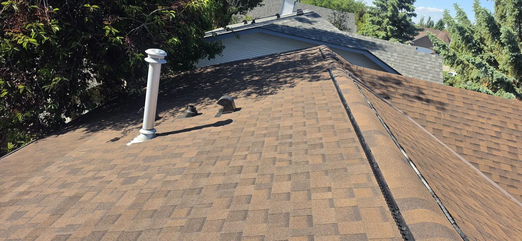 Completed roof detail after a partial replacement in Strathmore