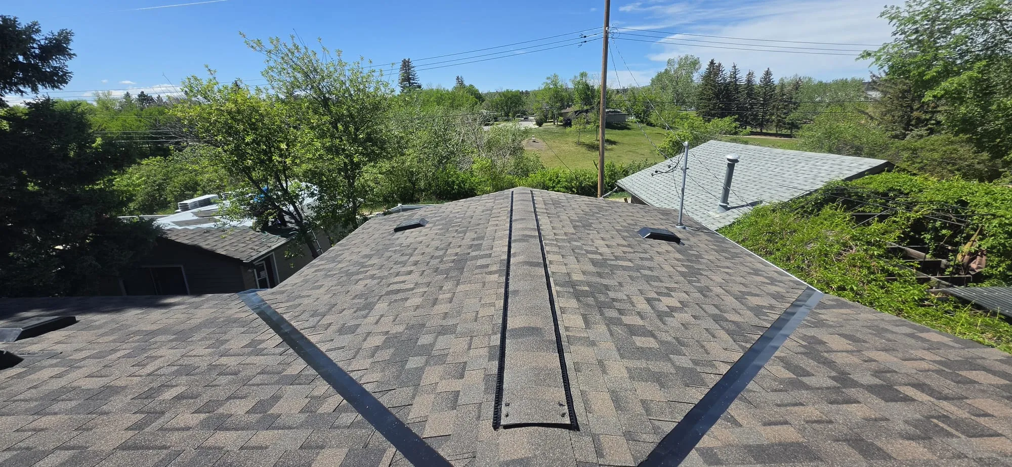 Asphalt shingle roof ridge vent in Calgary