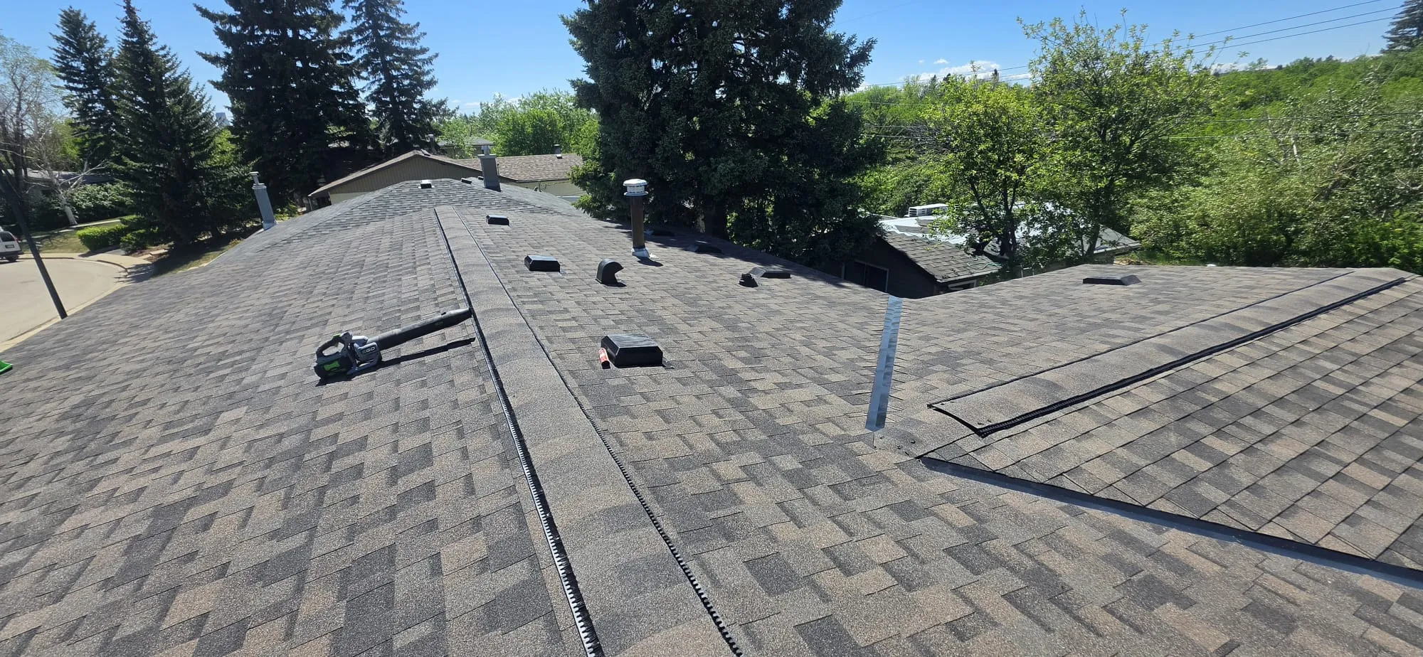 Brown shingle roof ridge vent completed in Calgary