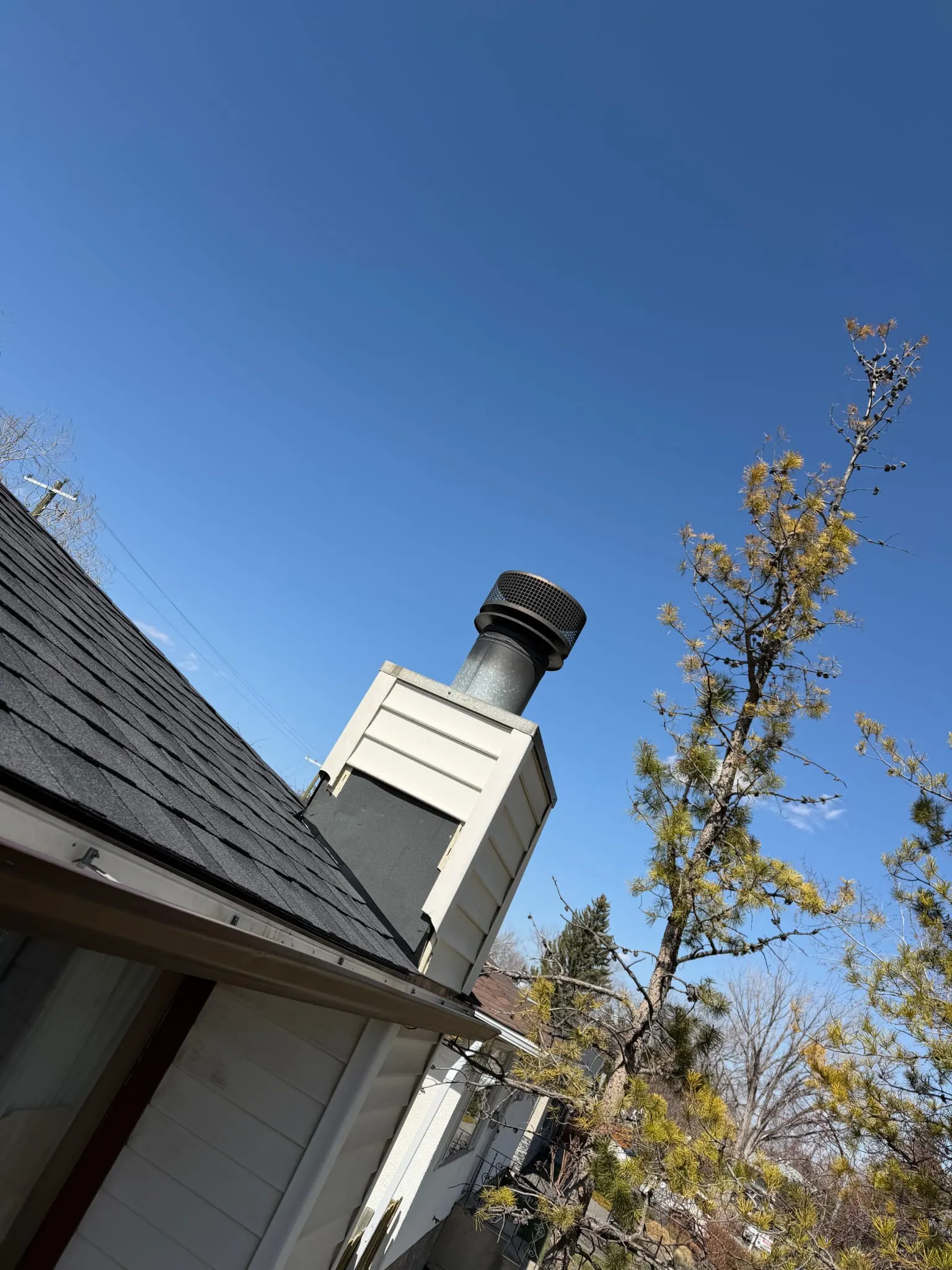 Chimney chase metal flue cap roof repair