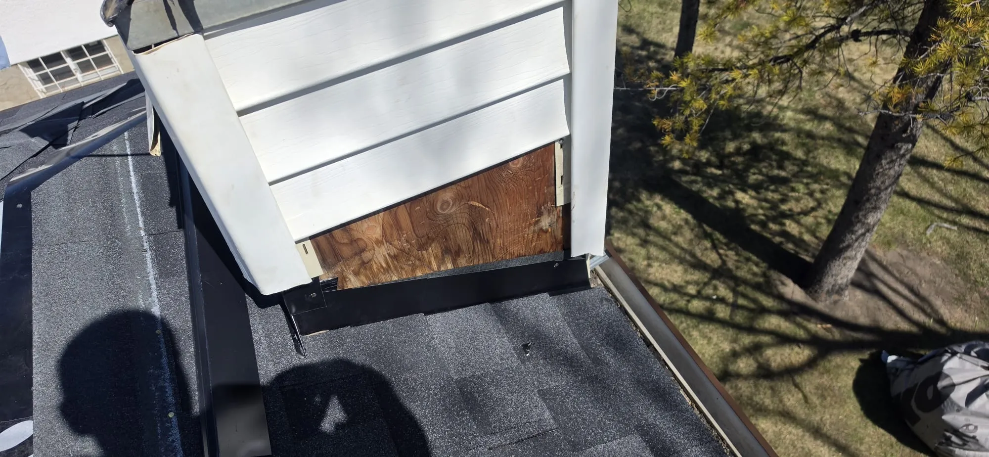 Dormer siding wall flashing repair in Calgary