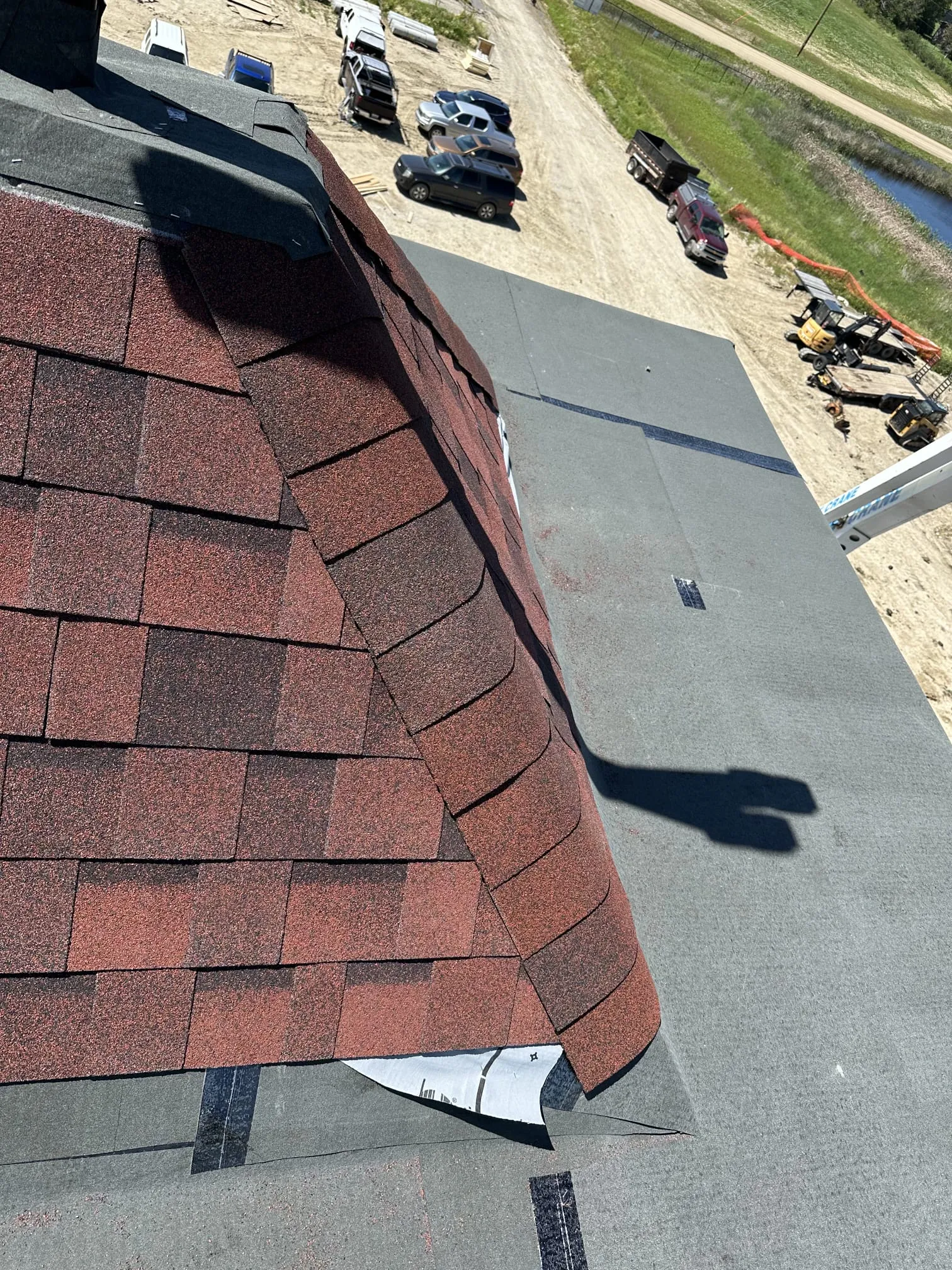 Flat roof membrane installation red shingles