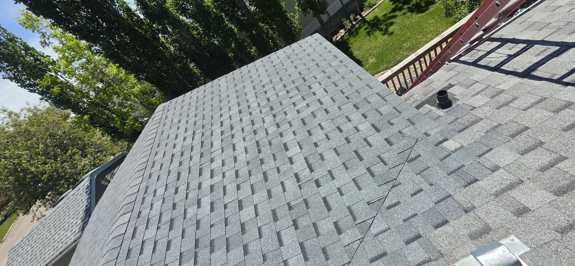 Grey shingle hip roof completed in Calgary