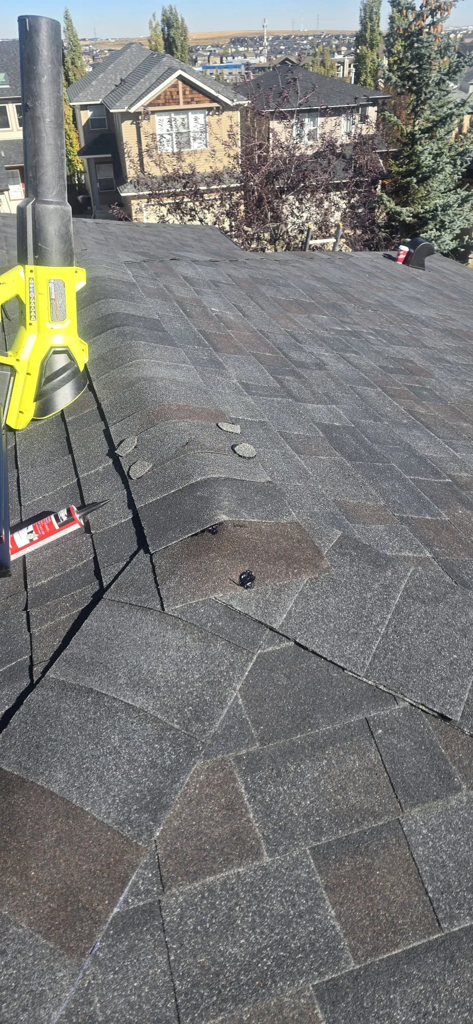 Hail damaged shingles repair sealant closeup