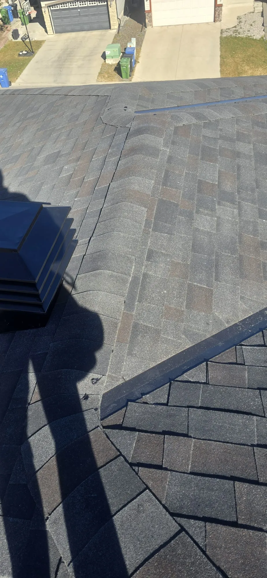 Hail damaged shingles roof vent closeup