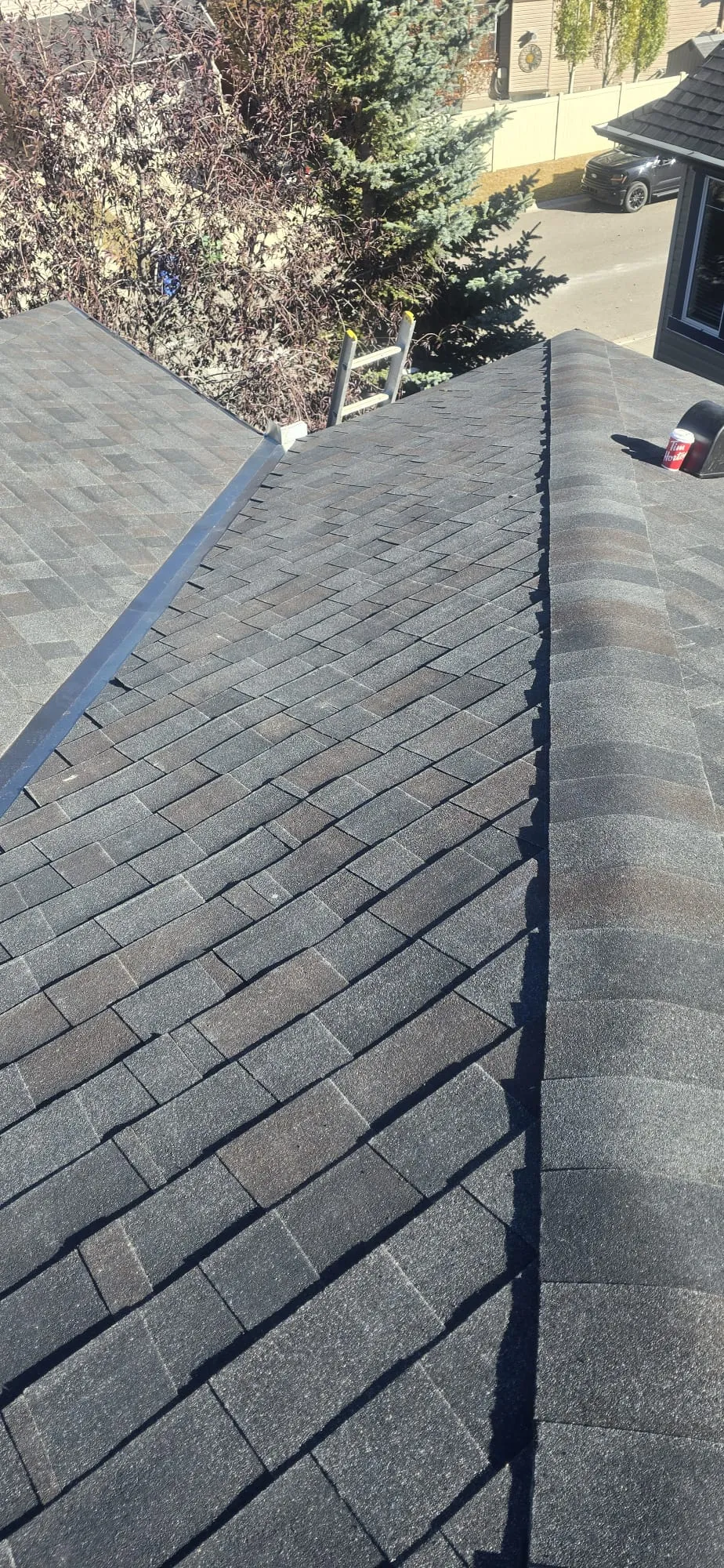 Hail worn shingle ridge inspection in Calgary
