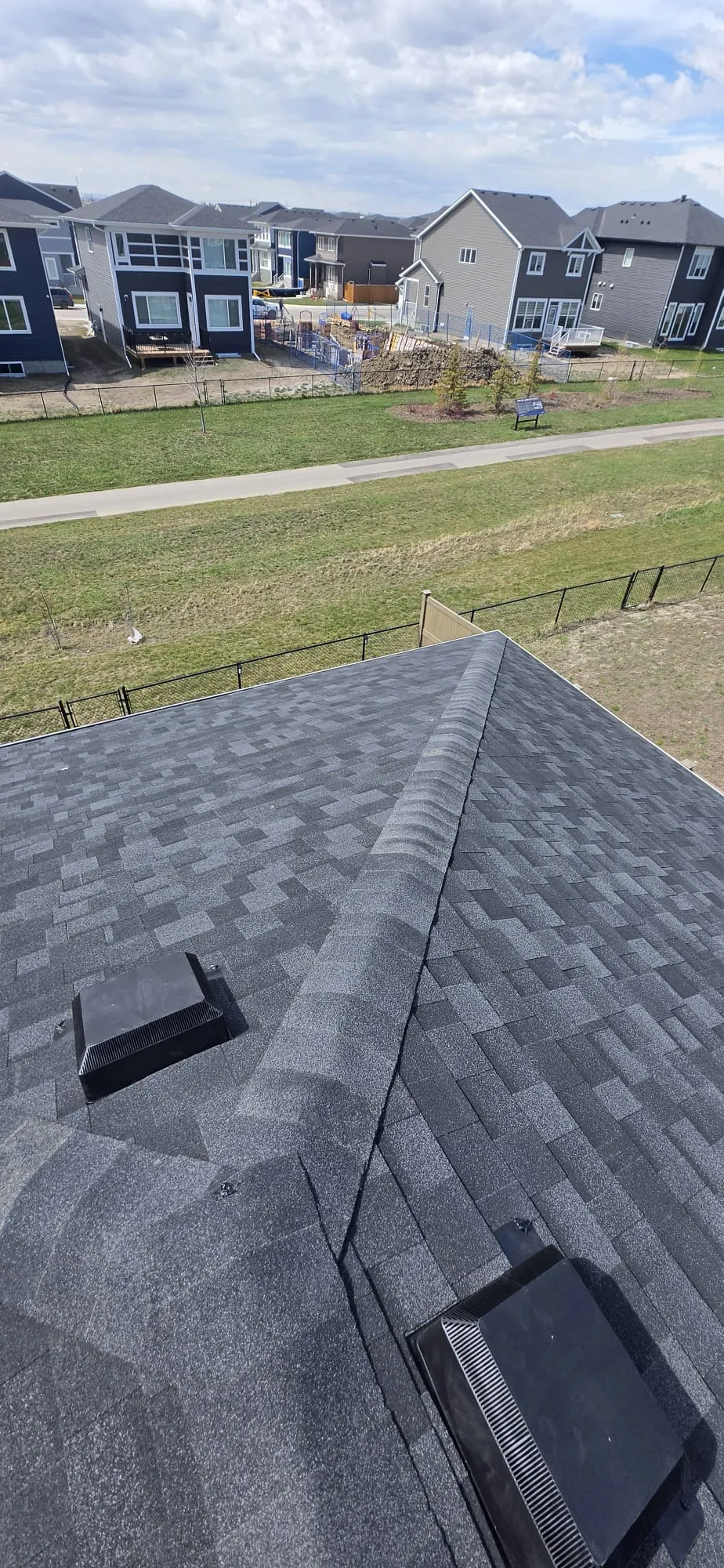 New charcoal asphalt shingle roof in Calgary
