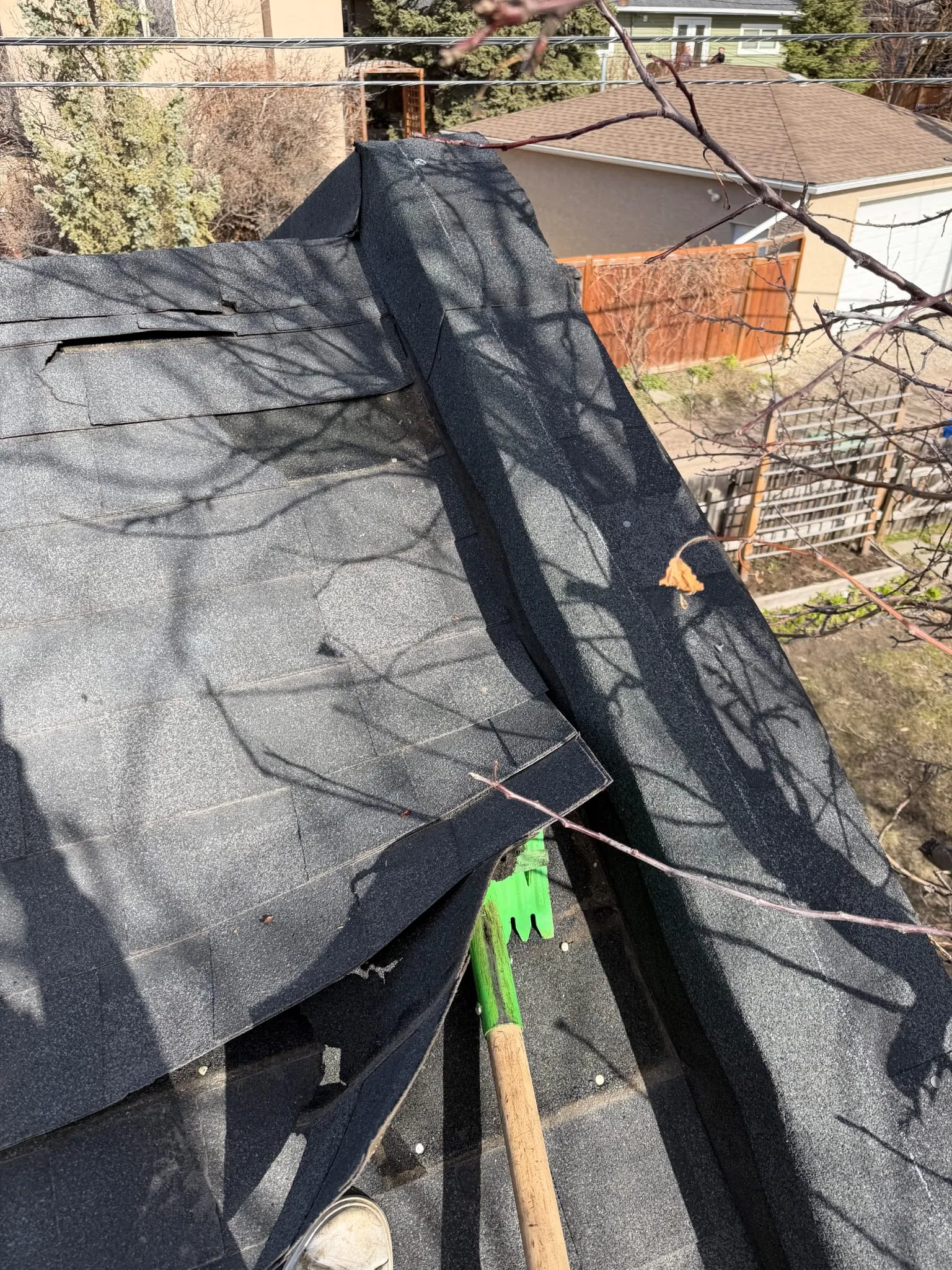 Ridge cap shingle repair in Calgary rooftop