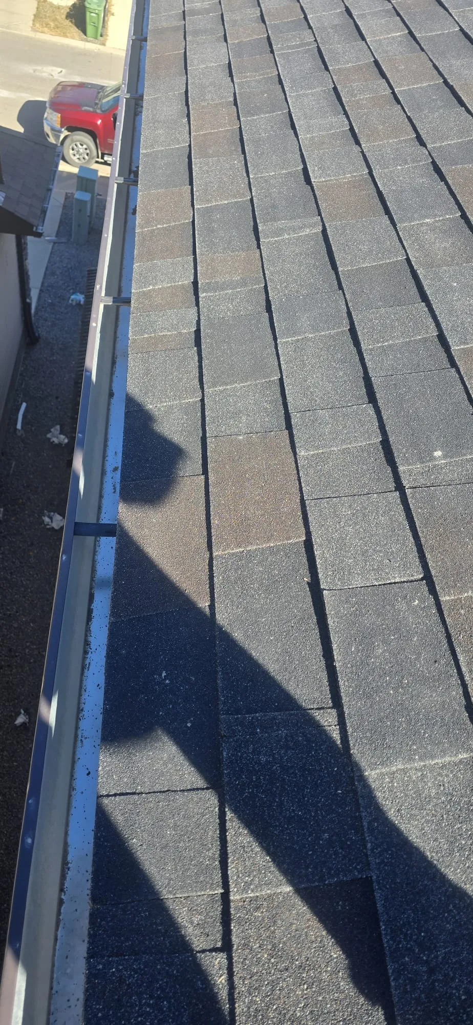 Weathered shingles eaves gutter hail inspection